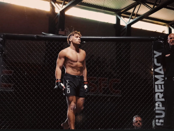 Coach in the cage before a fight